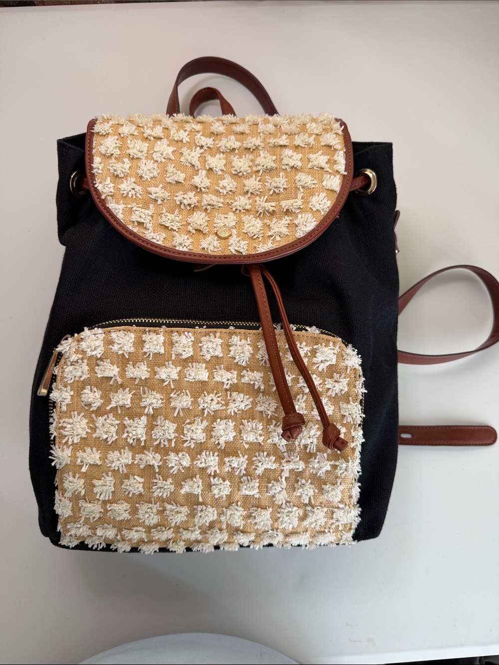 Tommy Bahama Black Backpack with Cream Woven Flap and Pocket and Brown Trim